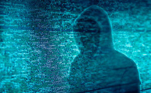 The silhouette of a stern in front of program code